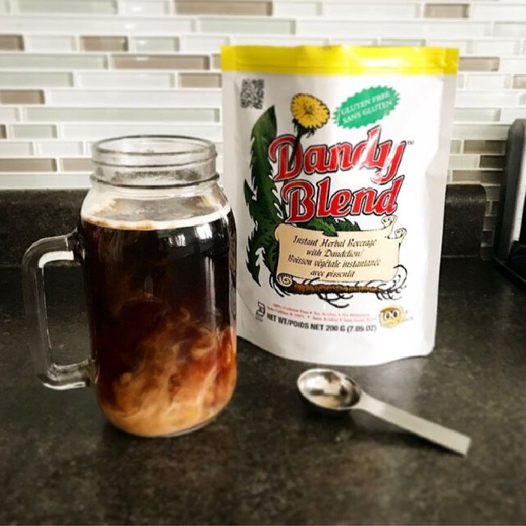 Dandy Blend Herbal Beverage Mix beside cup of coffee and measuring spoon gluten sugar caffeine free keto paleo – Raw Elements